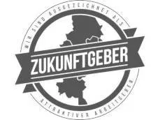 Üzerinde Zukunftsgeber kelimesi ve Almanca pasta grafikler bulunan yuvarlak bir plaket işveren için cazip bir ödüldür.